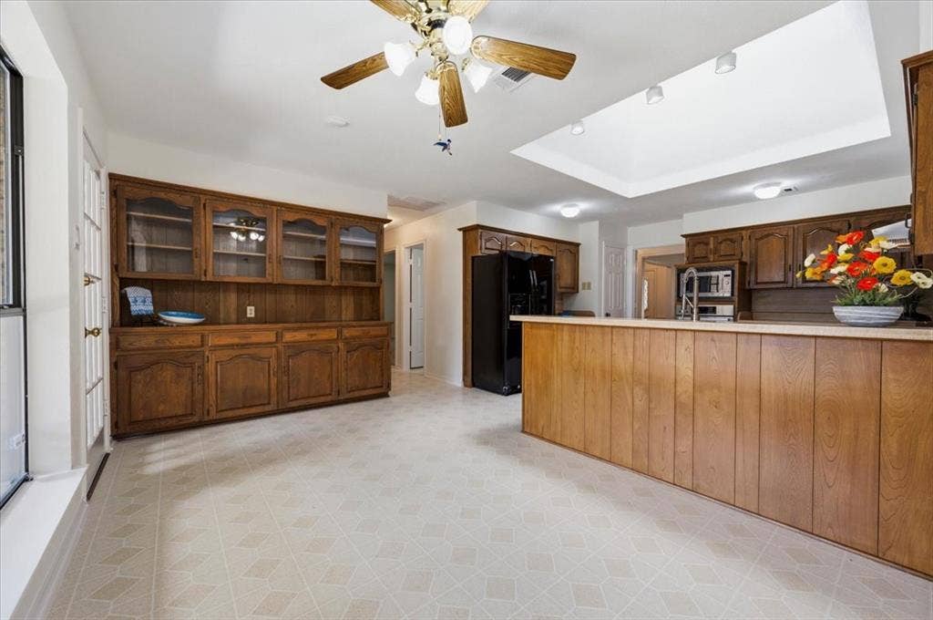 Lovely hutch with lots of storage, glass doors to display special items - ceiling fan in the breakfast area plus a view to the large covered patio