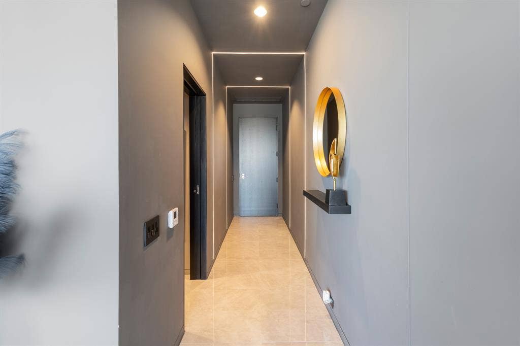 2430 Victory Park Lane, #2401, Dallas, TX 75219 Recessed ceiling lighting, linear strip lighting, flush-mount doors, and tile flooring