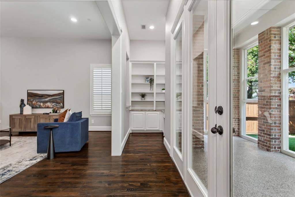 844 Veneto Drive, Allen, TX 75013 Center view showing the connection to the family room and enclosed back patio through a wide cased opening.Recessed lighting, a new 2026 ceiling fan, and a recessed secondary office on the back wall.