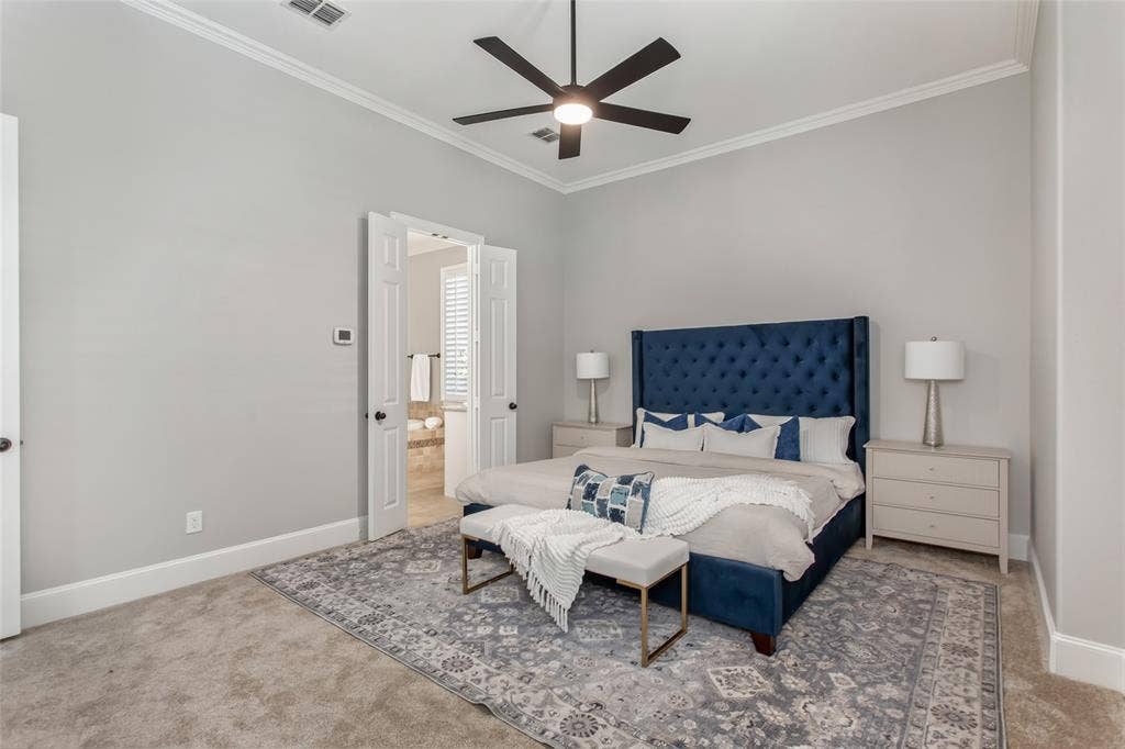 844 Veneto Drive, Allen, TX 75013 Double doors lead from the primary bedroom to the ensuite bath. Crown molding, a new 2026 ceilingfan, new carpet, and fresh 2026 paint.