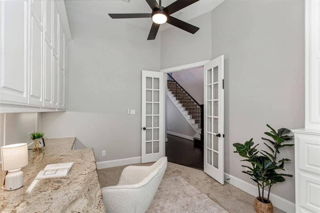 844 Veneto Drive, Allen, TX 75013 French doors with divided glass panes close the study off from the foyer for quiet work and calls.Granite desk surface and full-height built-in cabinets provide storage on both sides of the room.