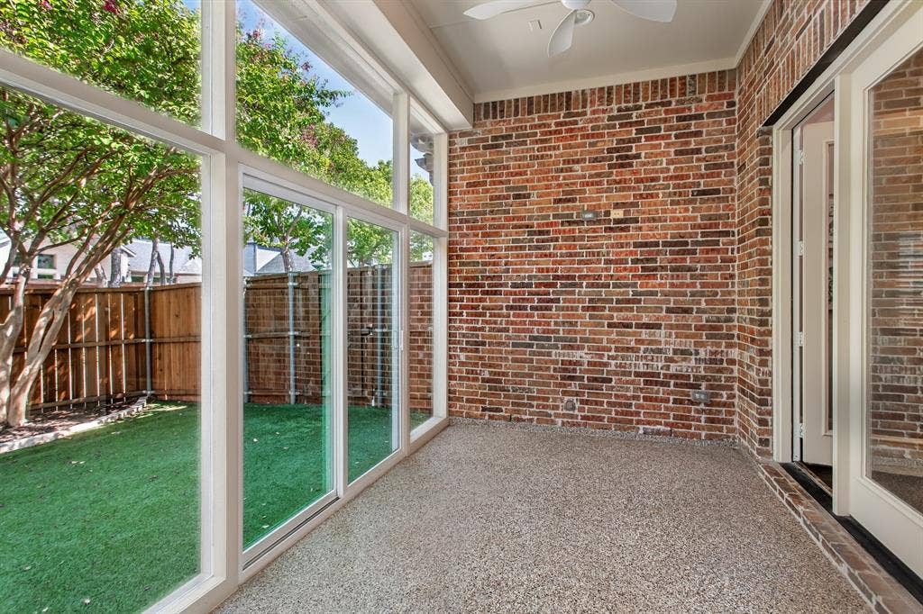 844 Veneto Drive, Allen, TX 75013 Floor-to-ceiling windows and a sliding glass door open to the low-maintenance artificial turf backyardand wood privacy fence. Gas line stubbed for a future outdoor kitchen.