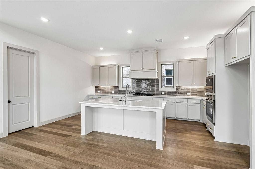 1109 Wheatgrass Mews, Celina, TX 75009 Featuring storage and prep space galore, the chef in the family will love creating culinary masterpieces in this dream kitchen!