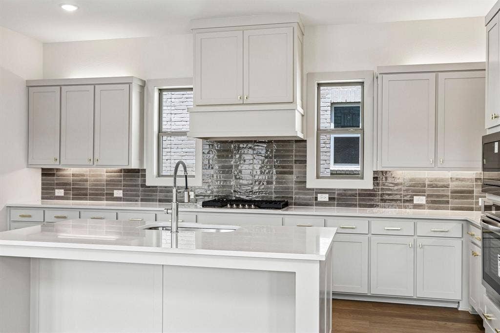 1109 Wheatgrass Mews, Celina, TX 75009 Beautiful cabinetry and gorgeous countertops paired with contemporary stainless steel create the kitchen of your dreams!