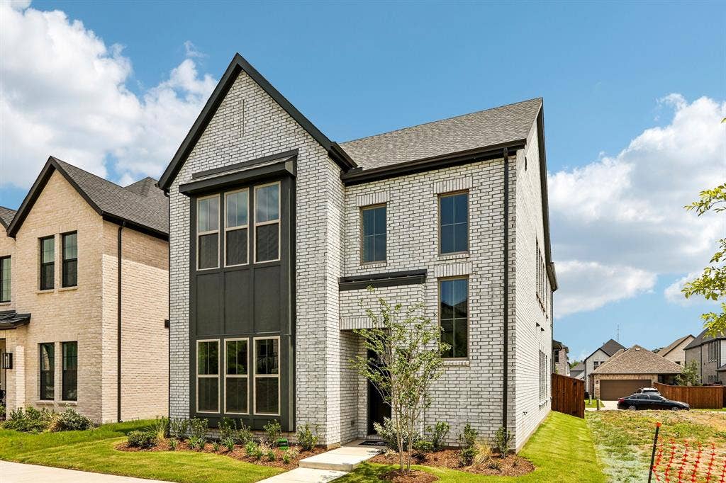 1109 Wheatgrass Mews, Celina, TX 75009 Featuring beautiful white brick with striking dark trim, this dream home offers outstanding curb appeal!
