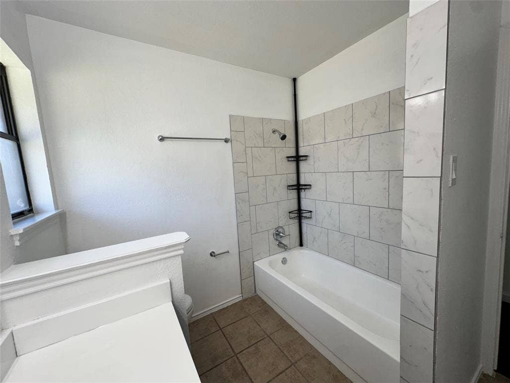 White subway tile shower surround with integrated storage shelving