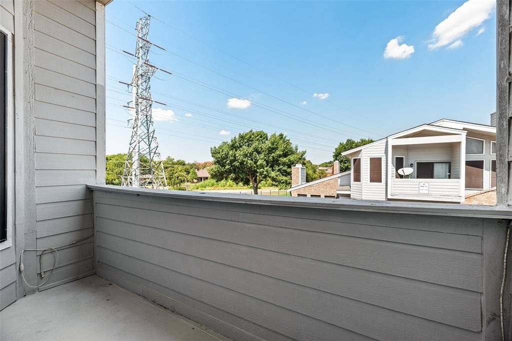 17490 Meandering Way, #202, Dallas, TX 75252 Balcony with horizontal siding and a concrete surface