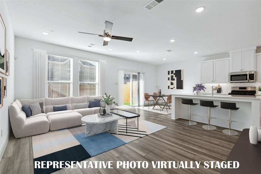 3727 Pierce Lane, Grand Prairie, TX 75052 Light, bright and airy, this open concept kitchen-dining-living area is everything you have been searching for! REPRESENTATIVE PHOTO VIRTUALLY STAGED