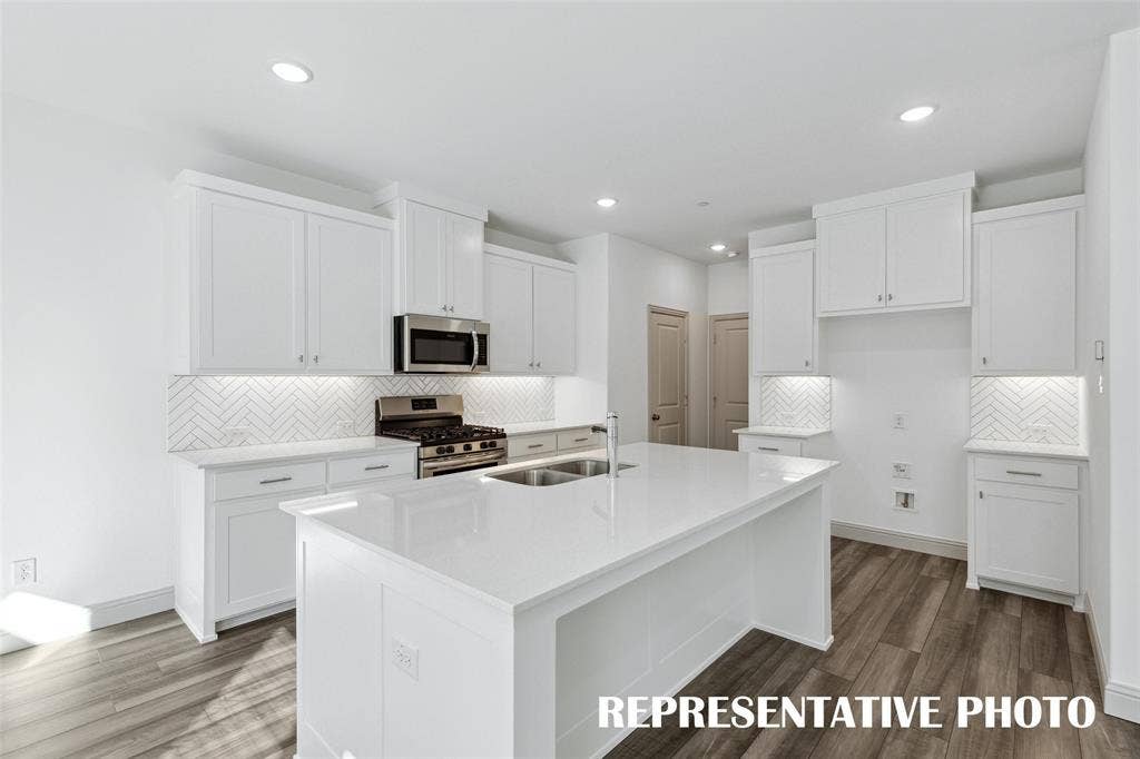 3727 Pierce Lane, Grand Prairie, TX 75052 The spacious island is the hub of your new kitchen and the perfect place for friends and family to gather round! REPRESENTATIVE PHOTO