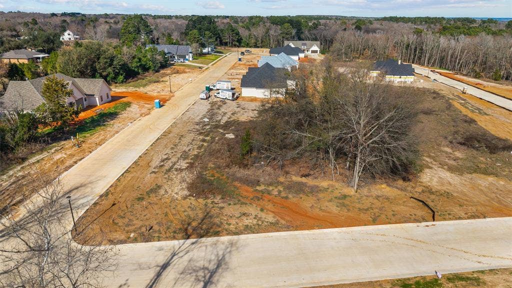 17154 Woodcrest Circle, Lindale, TX 75771 Undeveloped lot featuring a natural tree line and cleared building area