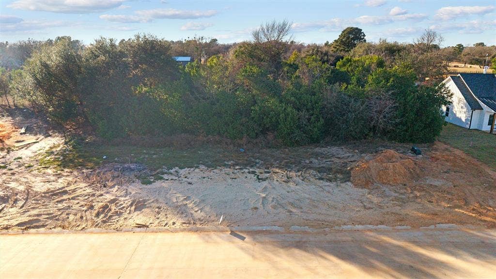 17154 Woodcrest Circle, Lindale, TX 75771 Cleared lot with mature trees and paved street frontage