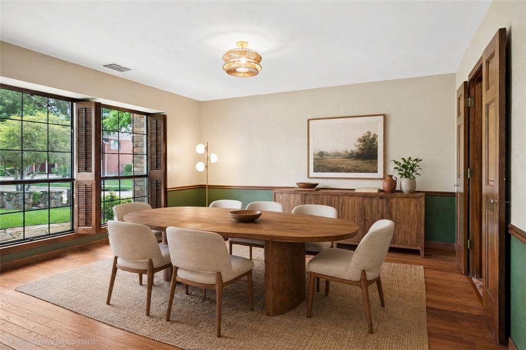 2001 Pebble Beach Court, Richardson, TX 75082 Formal dining room boasts rich hardwood floors and excellent view of the landscaped front yard (virtually staged).