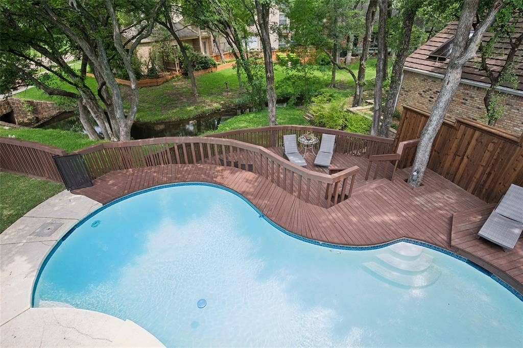 2001 Pebble Beach Court, Richardson, TX 75082 Woodsy paradise on the creek with shaded two tier deck. Pool comes with safety fence to protect little ones.
