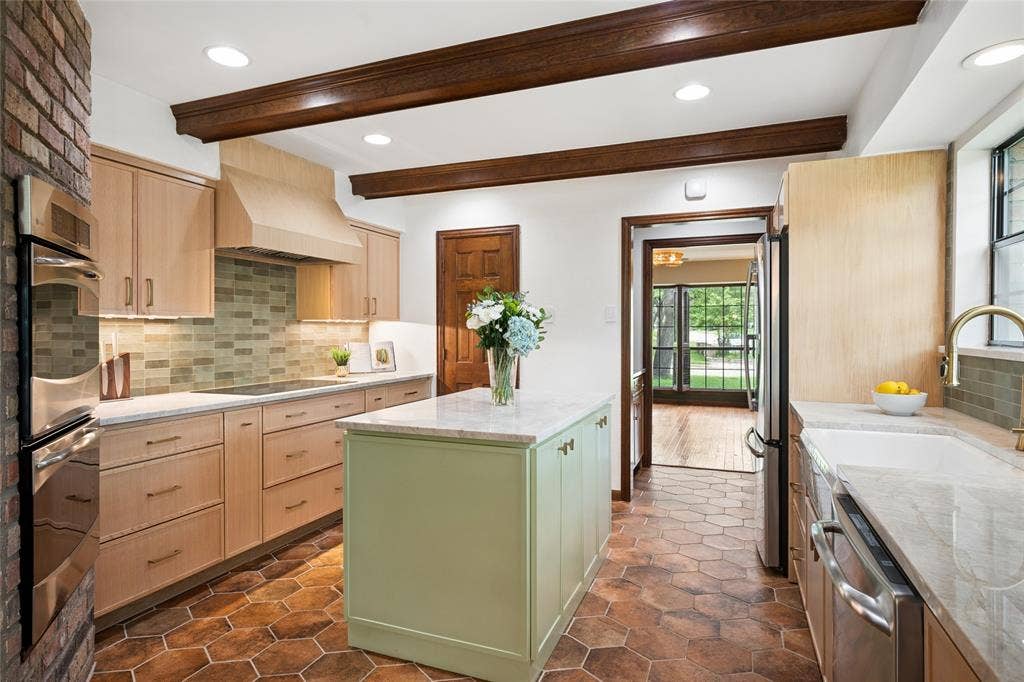 2001 Pebble Beach Court, Richardson, TX 75082 The kitchen island and ample counter space make meal prep a breeze.