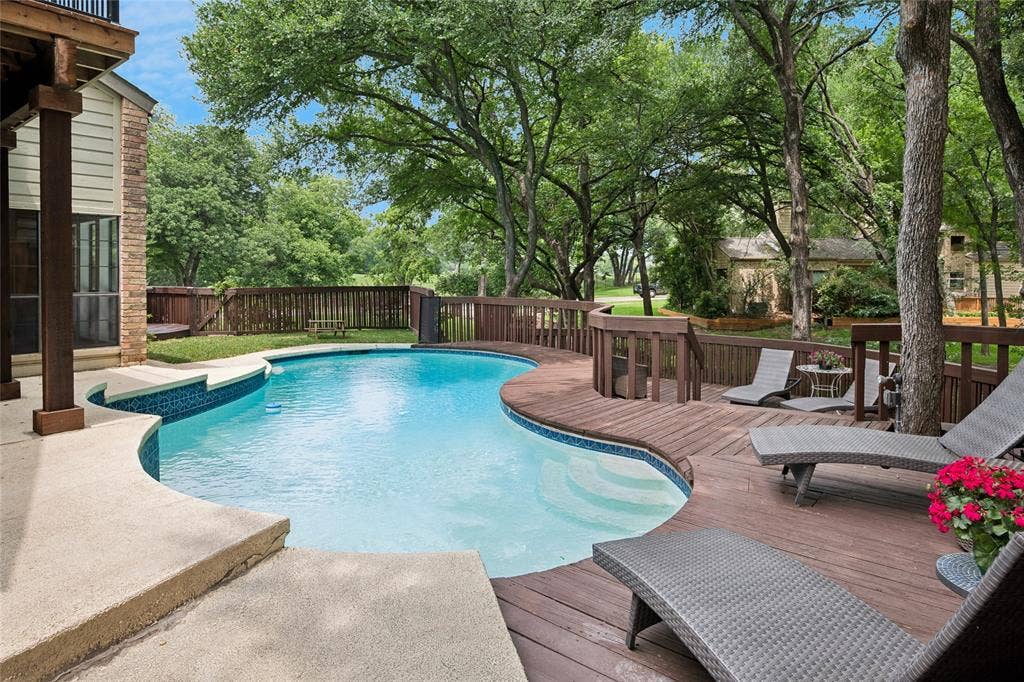 2001 Pebble Beach Court, Richardson, TX 75082 Come relax beside still waters around this custom two-tiered deck beneath shade trees.