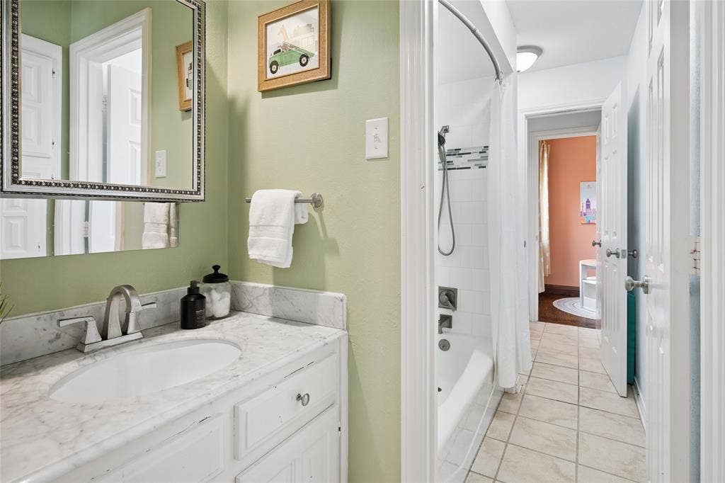 2001 Pebble Beach Court, Richardson, TX 75082 Plenty of space here in the Jack and Jill bathroom with updated Carrera Marble vanities.