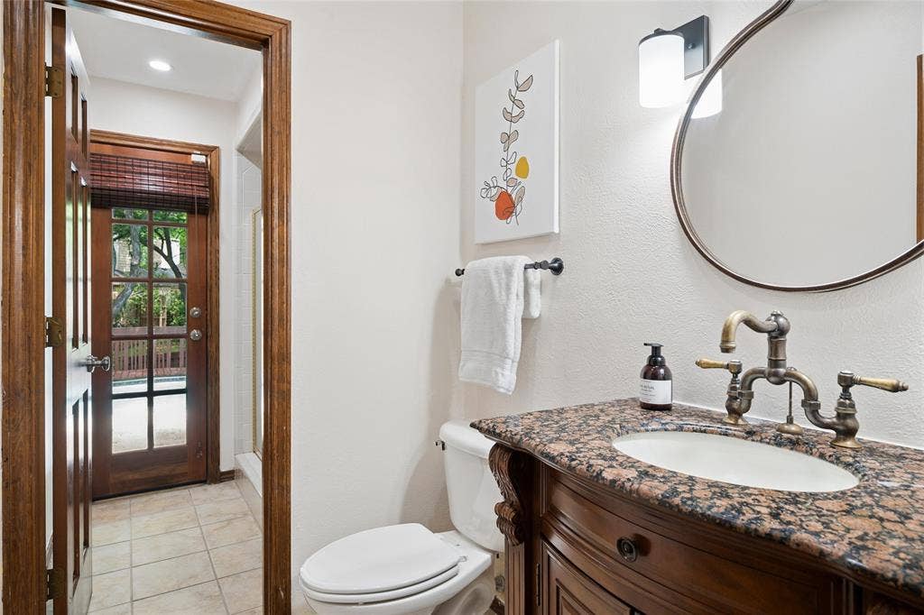 2001 Pebble Beach Court, Richardson, TX 75082 Full pool bath with shower sits just off the study and living are with direct access to pool and back yard.