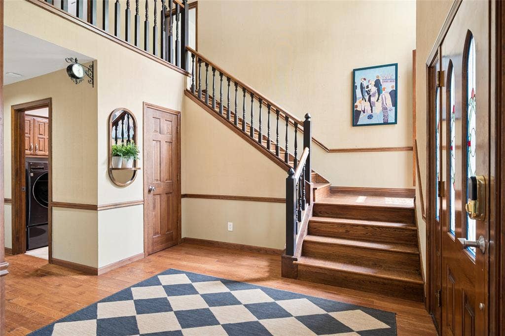 2001 Pebble Beach Court, Richardson, TX 75082 Rich hardwood floors and stairs along with soaring ceilings welcome you upon entry.