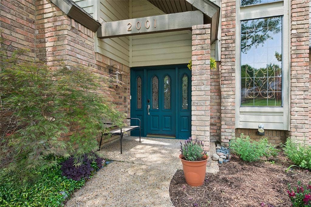 2001 Pebble Beach Court, Richardson, TX 75082 Beautiful forest teal front door brings a vibrant and welcoming look.