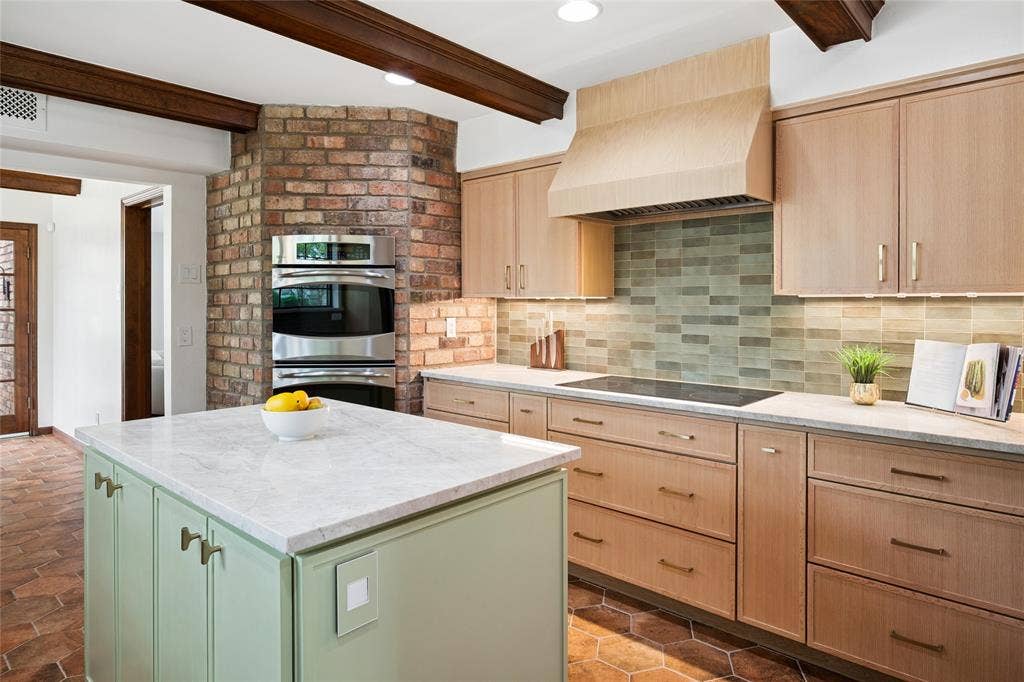 2001 Pebble Beach Court, Richardson, TX 75082 This culinary powerhouse is equipped with custom quartz counters, a double oven, under cab lighting and an induction cooktop.