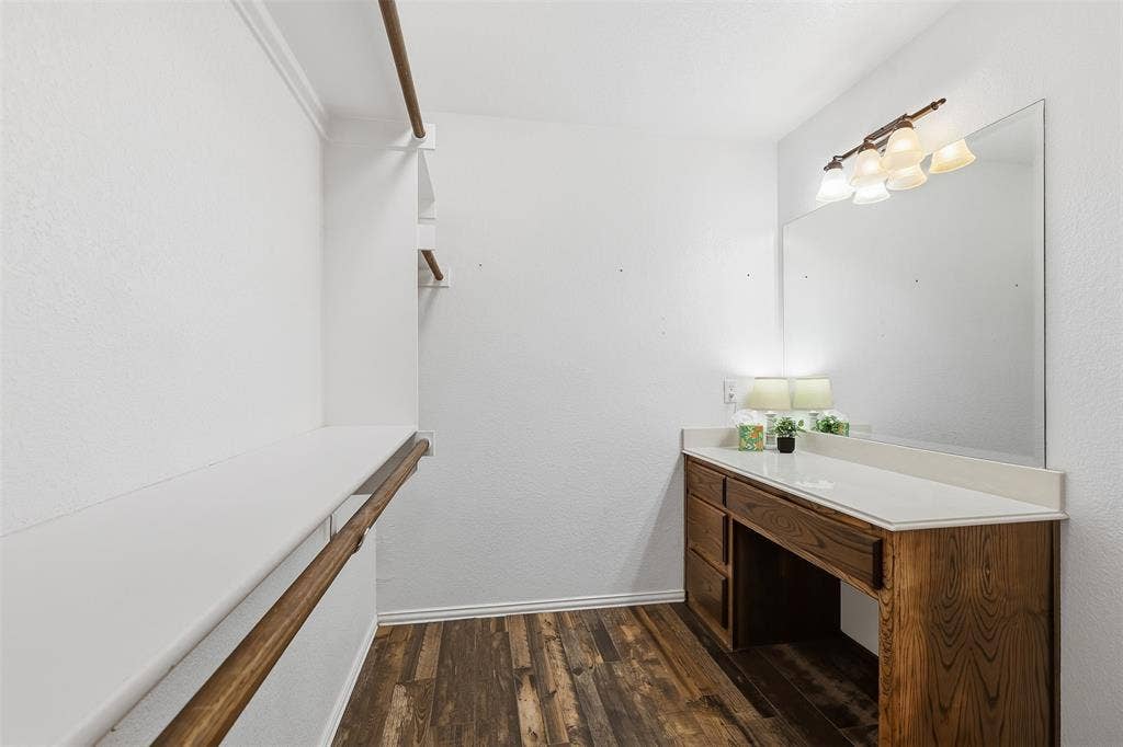 Wood-finish flooring with white baseboards