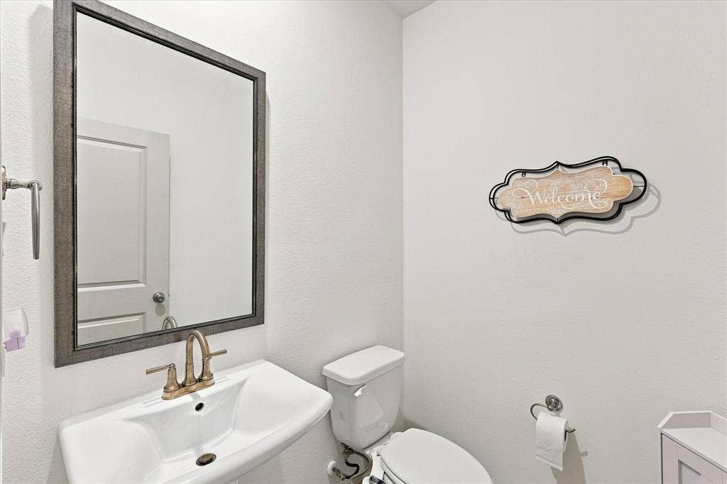 612 4th Street, Argyle, TX 76226 Half bath located down stairs for guests and convenience.