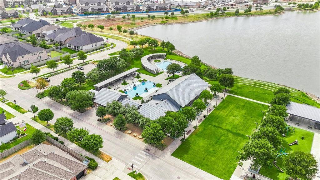 612 4th Street, Argyle, TX 76226 Community lake access, extensive greenspace, multiple swimming pools, community building, and covered outdoor areas
