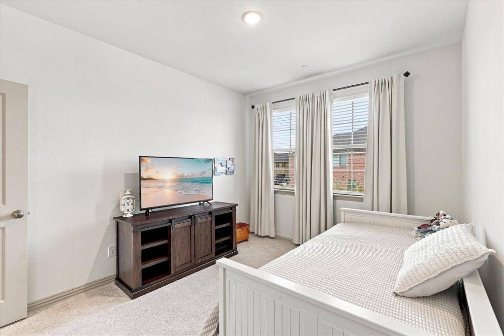612 4th Street, Argyle, TX 76226 Guest bedroom features split design for both owner and guests privacy.