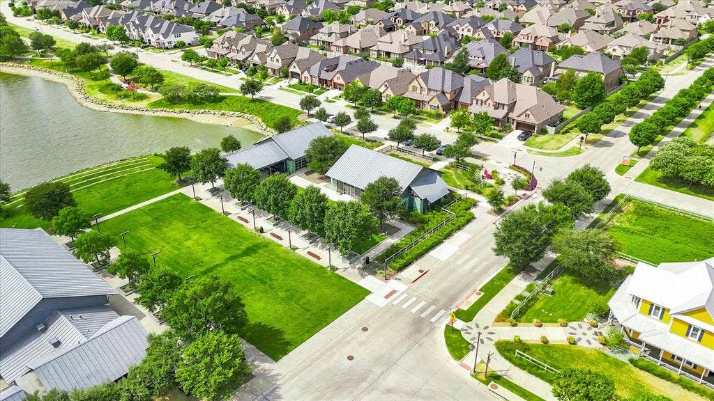 612 4th Street, Argyle, TX 76226 Community with extensive green spaces, a prominent body of water, and structured streetscapes