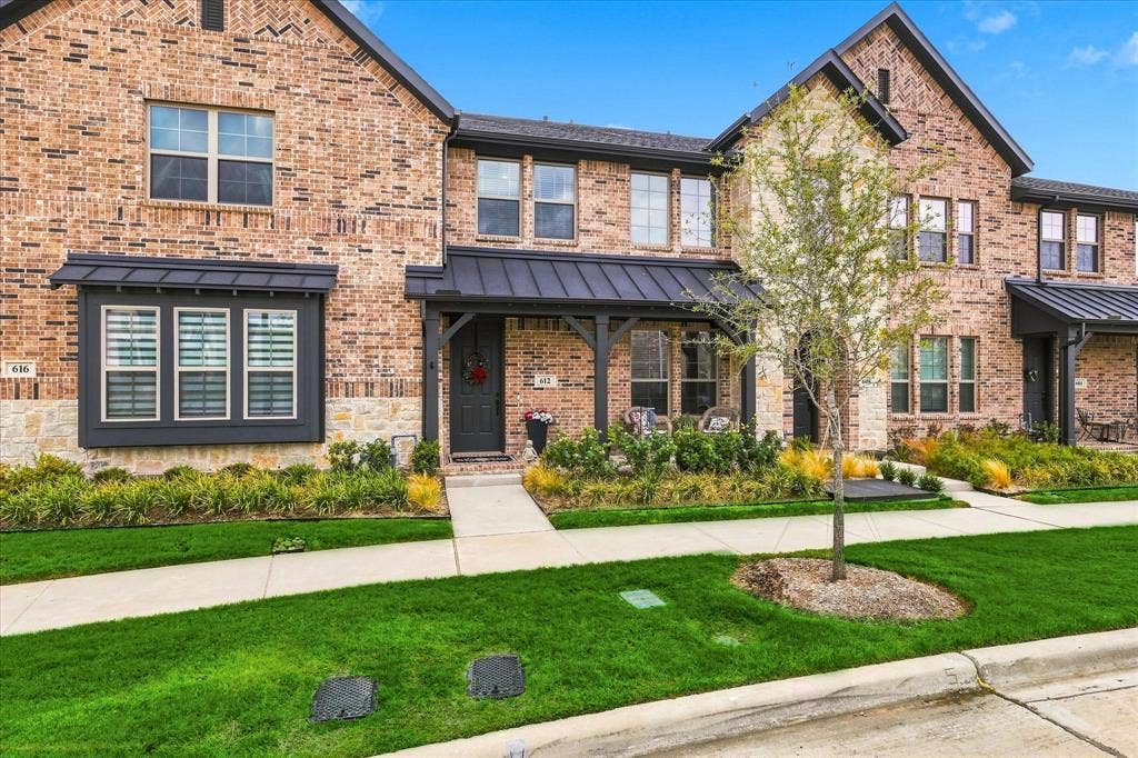 612 4th Street, Argyle, TX 76226 Brick exterior with stone accents, covered entry, and black metal awnings