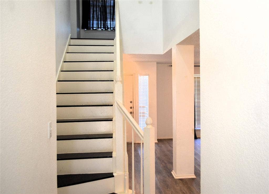 3994 Sword Dancer Way, Grand Prairie, TX 75052 Staircase with white risers and dark treads
