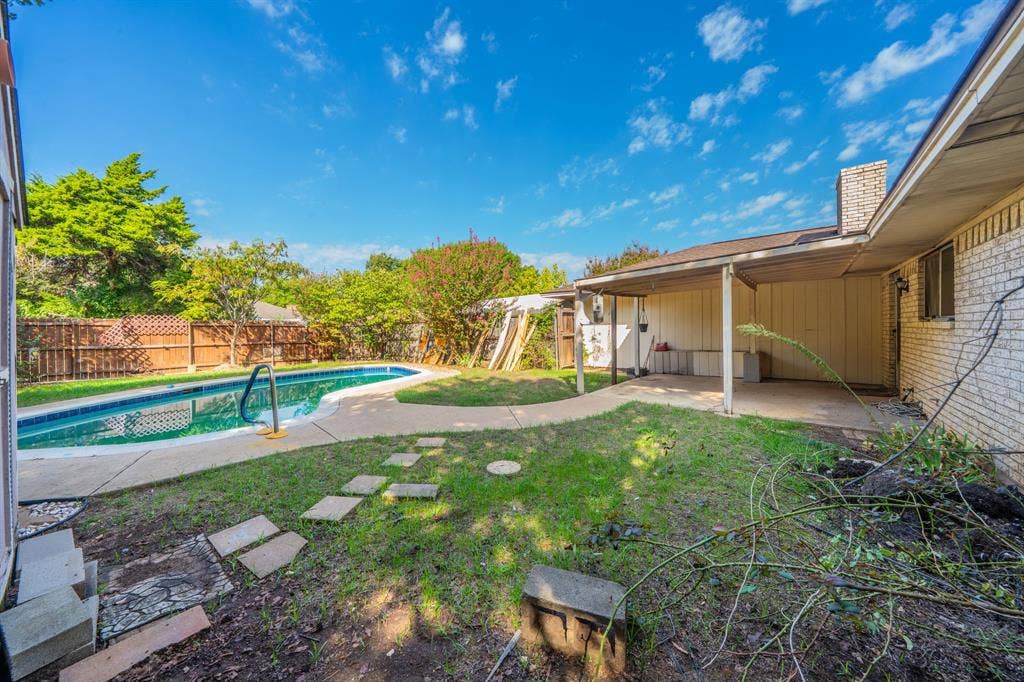 1517 Meadow Court, Midlothian, TX 76065 In-ground swimming pool with integrated steps, concrete patio surround, and a metal handrail