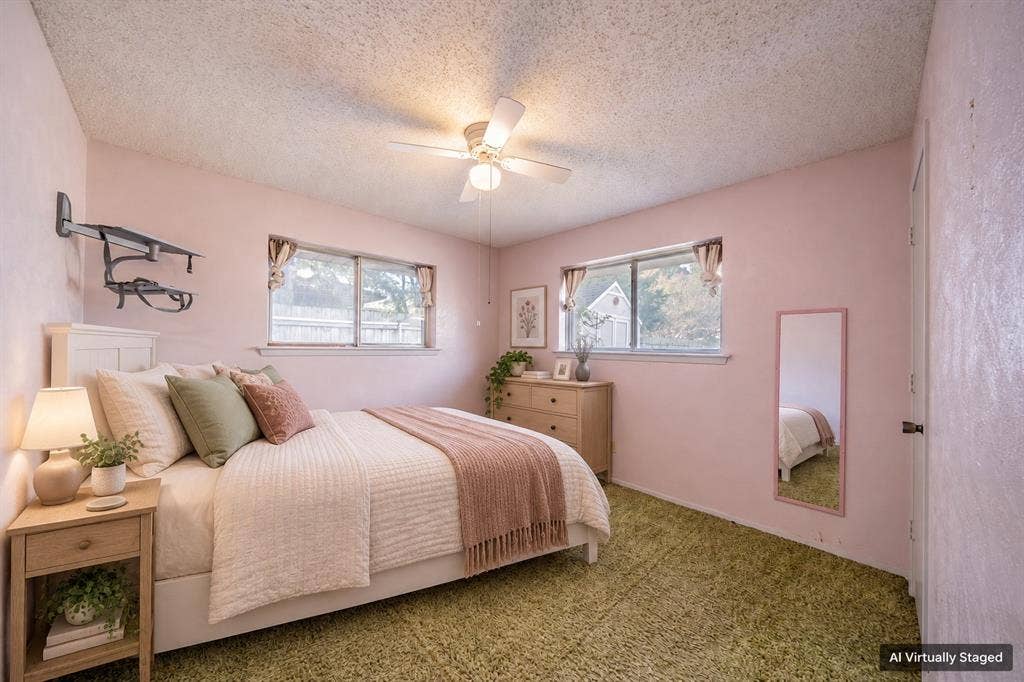 1517 Meadow Court, Midlothian, TX 76065 Two windows providing natural illumination, ceiling fan with integrated lighting, textured ceiling, and a paneled door
