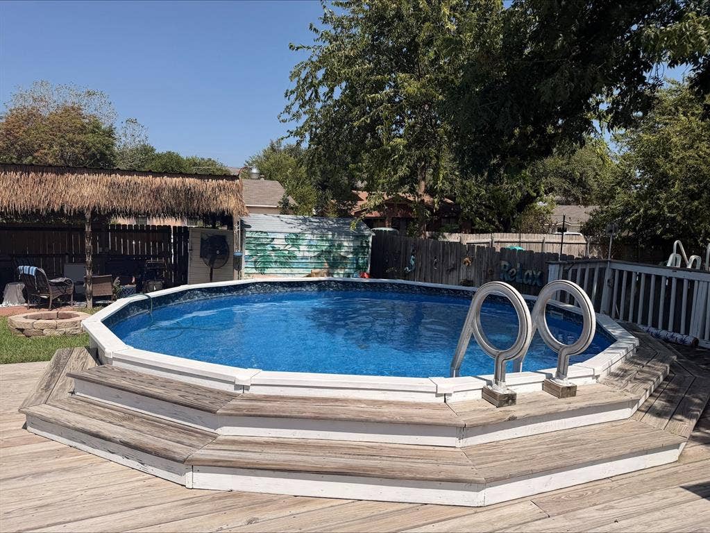 1920 Century Drive, Waco, TX 76712 Above-ground pool with surrounding wood-finish decking