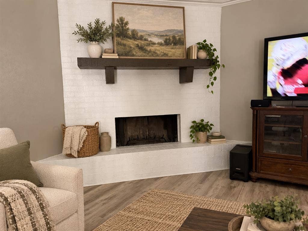 1920 Century Drive, Waco, TX 76712 Corner fireplace featuring white-painted brick and a dark wood-finish mantel