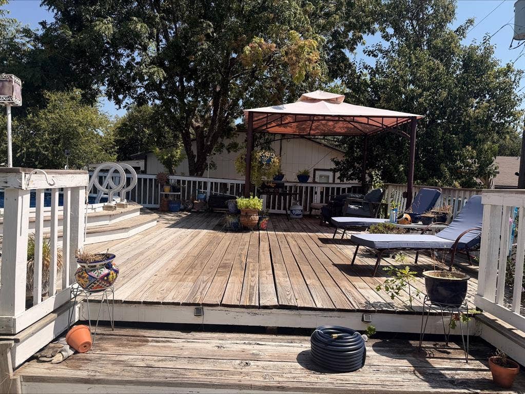 1920 Century Drive, Waco, TX 76712 Expansive wood-plank deck with white railings, featuring a built-in pool, and shaded by a gazebo