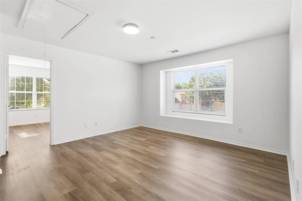 Another gameroom view with 2 bedrooms on either side of it.
