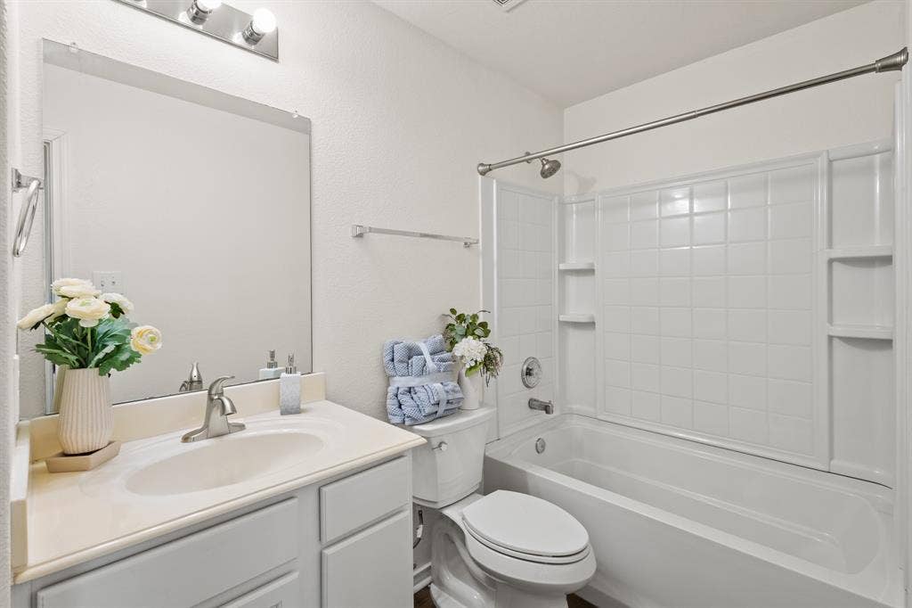 Bathroom vanity with integrated sink and chrome faucet