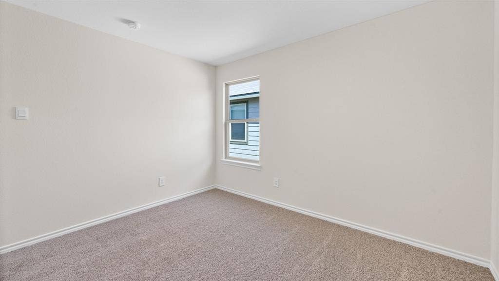 5622 Gannet Place, Crandall, TX 75114 Neutral-toned walls complement the carpeted flooring