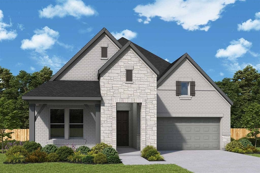 Stone and brick exterior with dark shingle roofing