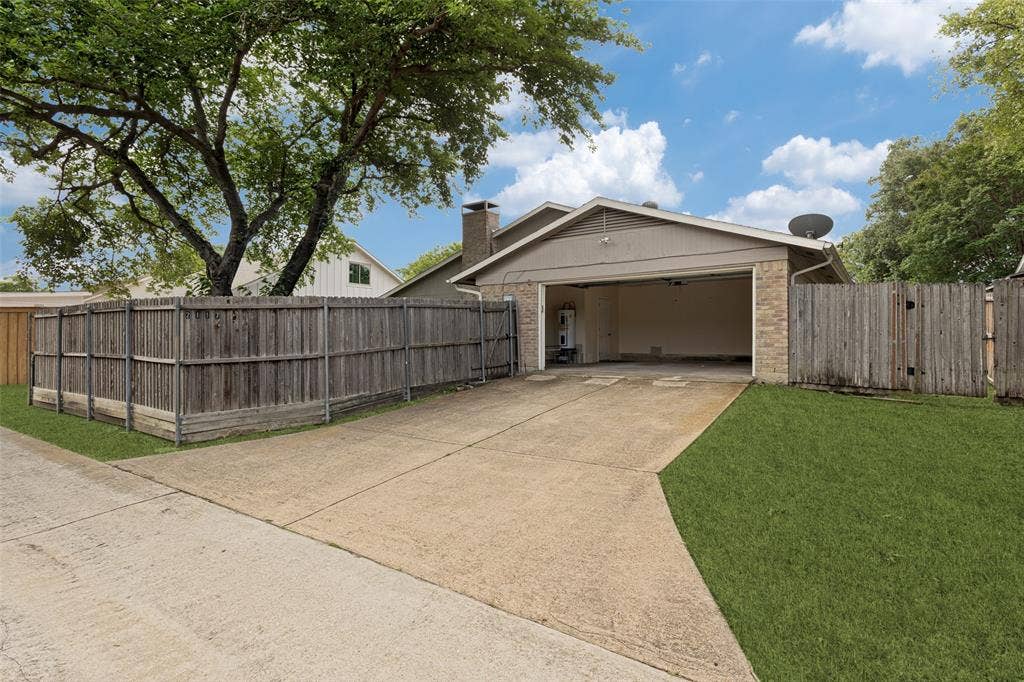 2117 Oak Brook Drive, Richardson, TX 75081 2-car garage with extra storage space, alley access, extra driveway parking.