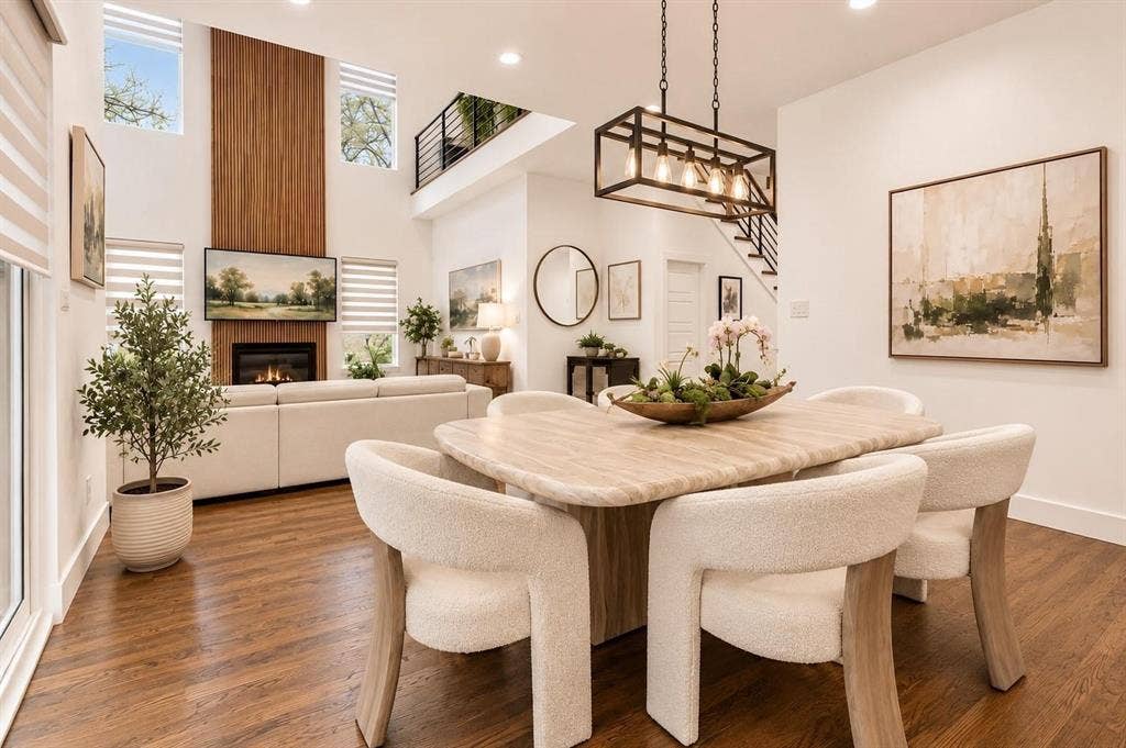 713 Wayne Street, Dallas, TX 75223 Open-concept living area with hardwood flooring, a fireplace, and a high-vaulted ceiling