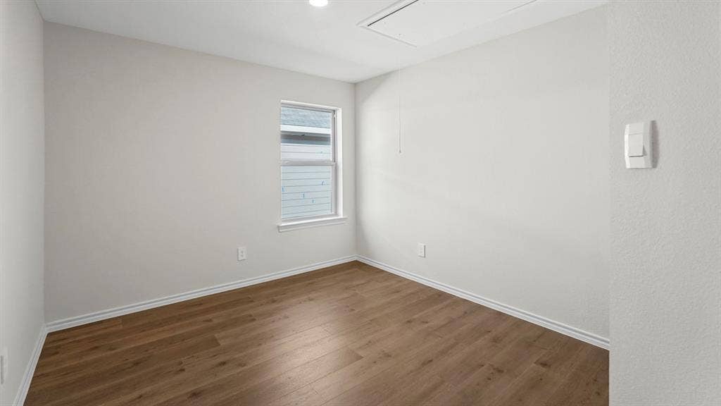 227 Whispering Pine Drive, Royse City, TX 75189 Recessed lighting, wood-finish flooring, white trim, single window, and neutral wall tones