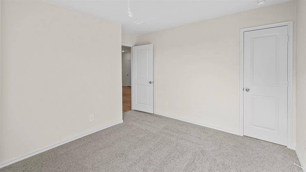 227 Whispering Pine Drive, Royse City, TX 75189 Light gray carpeting and neutral wall paint