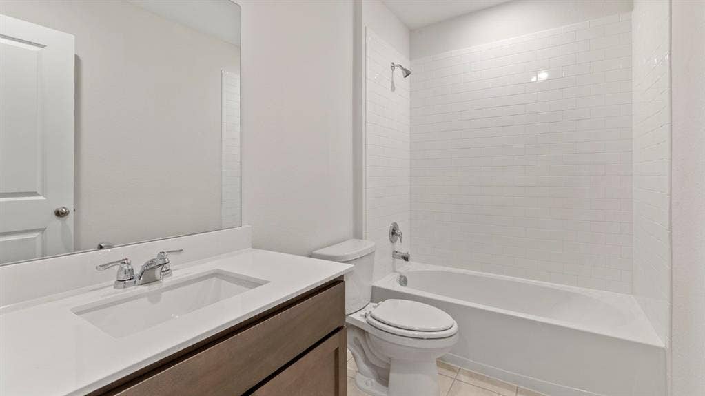 223 Yates Street, Bullard, TX 75757 Modern vanity with an integrated sink and chrome fixtures
