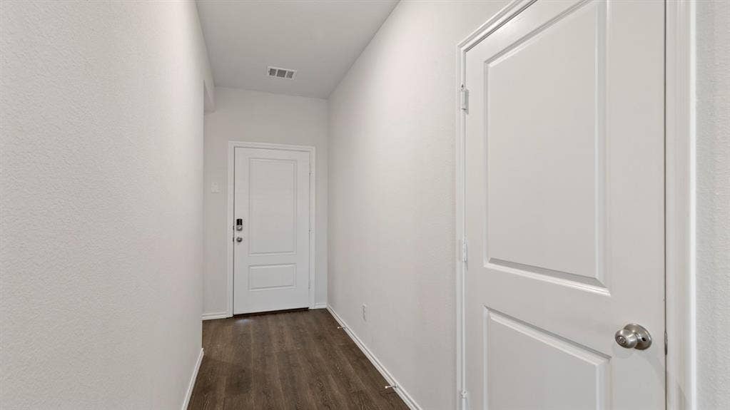 223 Yates Street, Bullard, TX 75757 Wood-finish flooring with white baseboards
