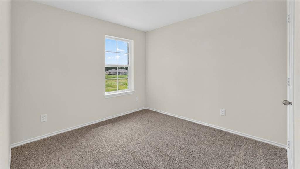 237 Yates Street, Bullard, TX 75757 Neutral-toned walls complement the gray carpet flooring