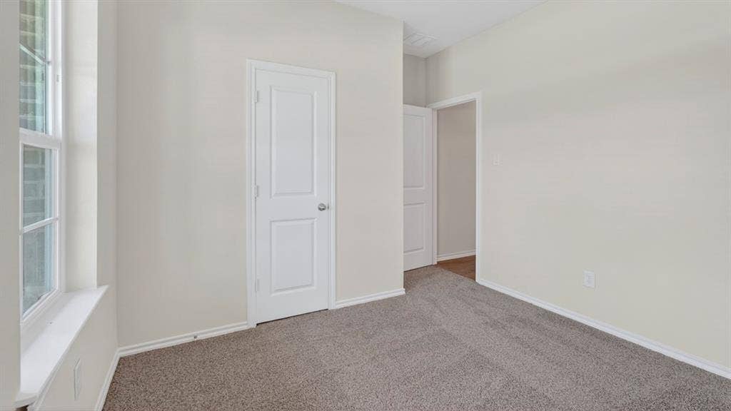 237 Yates Street, Bullard, TX 75757 Neutral wall color, grey carpet flooring, white trim, recessed window, and solid panel doors