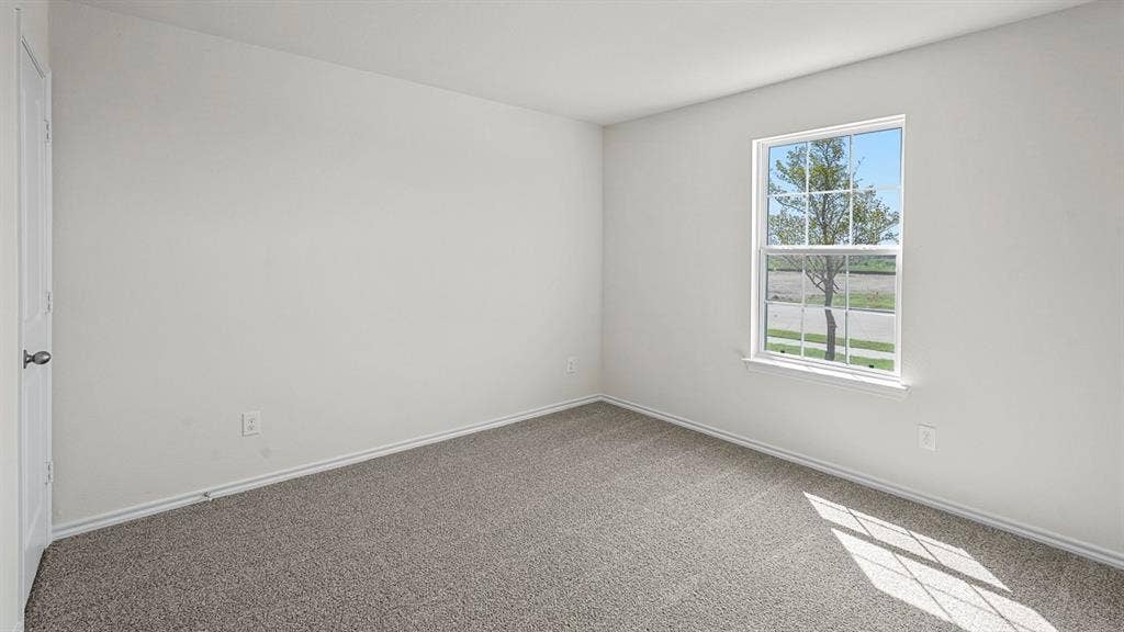 185 Brooks Street, Bullard, TX 75757 Carpeted flooring, white painted walls, single window with grid pattern, white trim