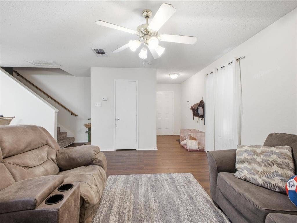 2001 Waleska Plaza, Dallas, TX 75211 Recessed lighting and a ceiling fan with integrated lighting illuminate the space